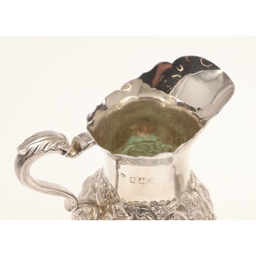 86 - A VICTORIAN GEORGE II STYLE IRISH SILVER CREAM JUG AND SUGAR BOWL. The jug and sugar bowl both with ... 