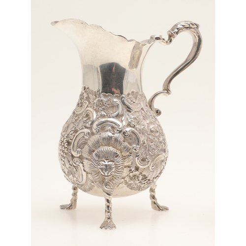 86 - A VICTORIAN GEORGE II STYLE IRISH SILVER CREAM JUG AND SUGAR BOWL. The jug and sugar bowl both with ... 