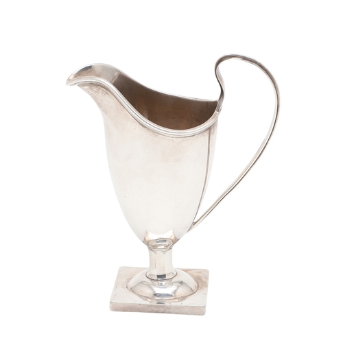 88 - A VICTORIAN SILVER HELMET JUG. On a square foot, hallmarked Florence Warden, Chester, 1895. Height 1... 