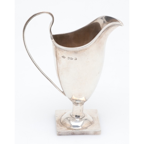 88 - A VICTORIAN SILVER HELMET JUG. On a square foot, hallmarked Florence Warden, Chester, 1895. Height 1... 