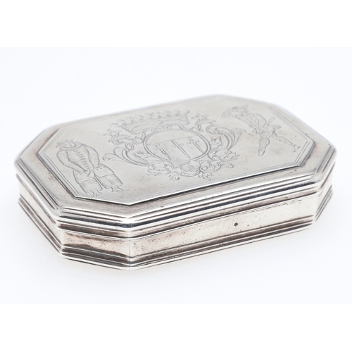 93 - AN 18TH CENTURY SILVER SNUFF BOX. Of octagonal form, the cover engraved with a coat of arms flanked ... 