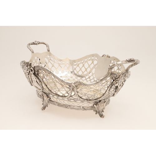97 - A 19TH CENTURY DUTCH SILVER TWIN HANDLED BREAD BASKET. Of shaped oval form in the Louis Seize style,... 