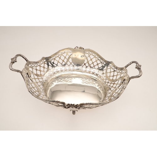 97 - A 19TH CENTURY DUTCH SILVER TWIN HANDLED BREAD BASKET. Of shaped oval form in the Louis Seize style,... 