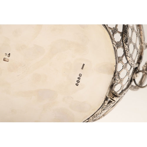 97 - A 19TH CENTURY DUTCH SILVER TWIN HANDLED BREAD BASKET. Of shaped oval form in the Louis Seize style,... 