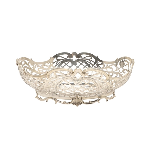98 - A DUTCH SILVER BREAD BASKET. Of shaped oval form, decorated with pierced foliate scrolls and lattice... 