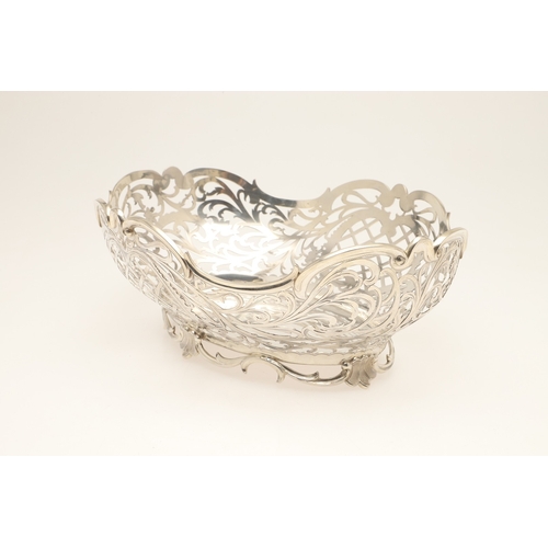 98 - A DUTCH SILVER BREAD BASKET. Of shaped oval form, decorated with pierced foliate scrolls and lattice... 