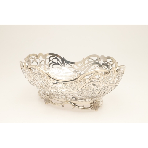 98 - A DUTCH SILVER BREAD BASKET. Of shaped oval form, decorated with pierced foliate scrolls and lattice... 