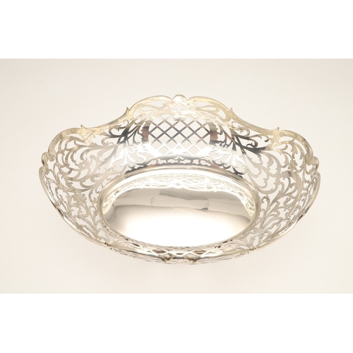 98 - A DUTCH SILVER BREAD BASKET. Of shaped oval form, decorated with pierced foliate scrolls and lattice... 