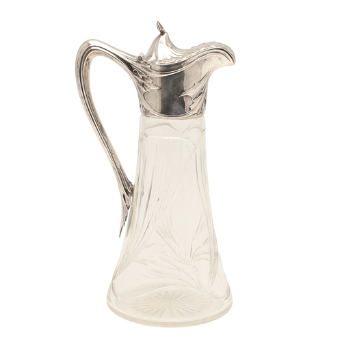 99 - A LATE 19TH CENTURY ARTS AND CRAFTS GERMAN SILVER MOUNTED GLASS CLARET JUG. An Arts and Crafts clare... 