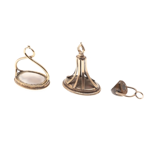 119 - TWO GEORGE 111 GOLD FOB SEALS. each with oval hardstone armorial intaglio and another small seal.