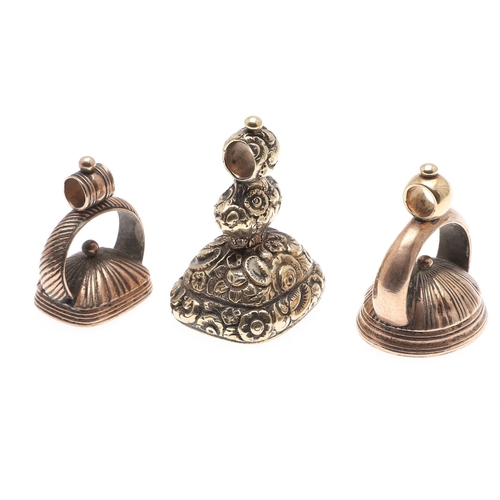 120 - THREE 19TH C. GOLD FOB SEALS. each with hardstone armorial intaglio and one with floral decoration.