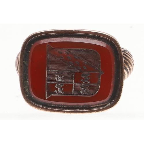 120 - THREE 19TH C. GOLD FOB SEALS. each with hardstone armorial intaglio and one with floral decoration.