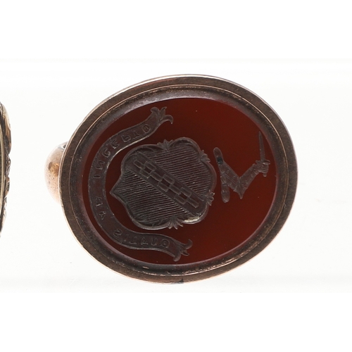 120 - THREE 19TH C. GOLD FOB SEALS. each with hardstone armorial intaglio and one with floral decoration.