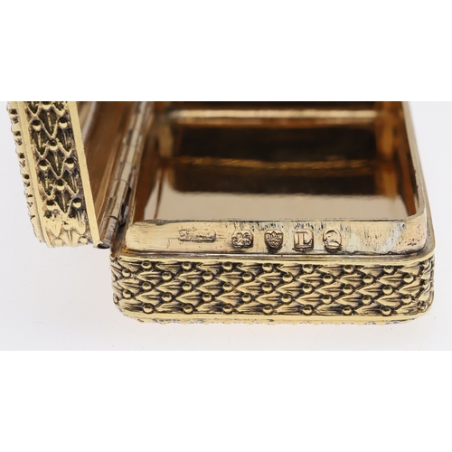 126 - A GEORGE III SILVER GILT SNUFF BOX. Of rectangular form with faux basket weave decoration, later eng... 