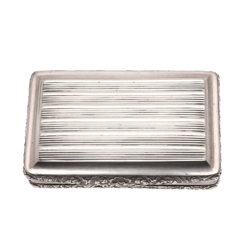 128 - A GEORGE III SILVER SNUFF BOX. Of oblong form, with reeded decoration and chased floral borders with... 