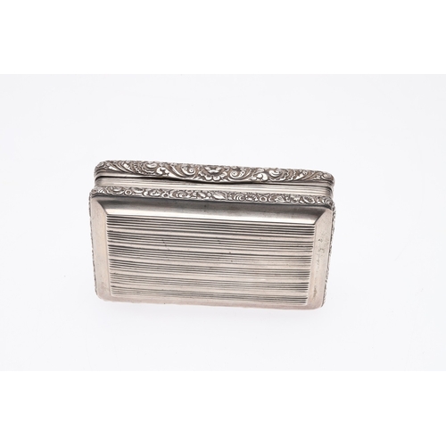 128 - A GEORGE III SILVER SNUFF BOX. Of oblong form, with reeded decoration and chased floral borders with... 