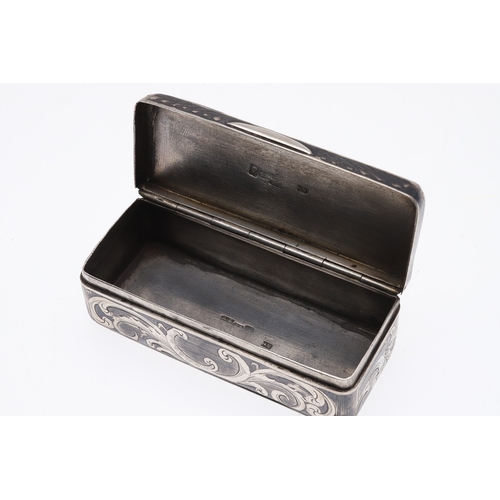 130 - A LATE 19TH CENTURY RUSSIAN SILVER AND NIELLO SNUFF BOX. The lid engraved with a city view, the side... 