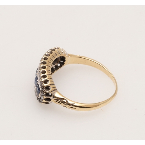 209 - A SAPPHIRE AND DIAMOND RING. the central row of graduated circular-cut sapphires is set within a sur... 