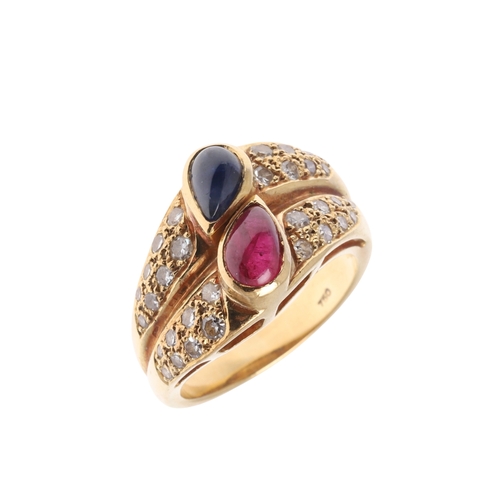 221 - A SAPPHIRE, RUBY AND DIAMOND DOUBLE BAND RING. centred with a pear-shaped ruby and sapphire cabochon... 