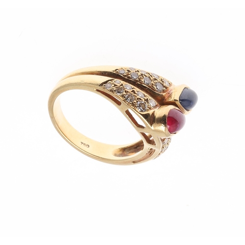 221 - A SAPPHIRE, RUBY AND DIAMOND DOUBLE BAND RING. centred with a pear-shaped ruby and sapphire cabochon... 