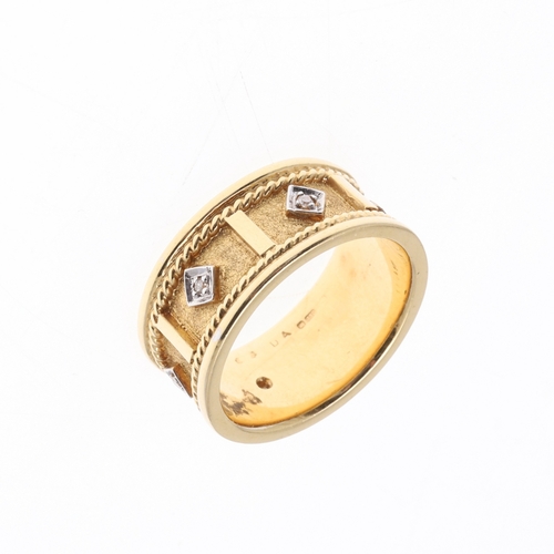 226 - A DIAMOND AND 18CT GOLD RING. the gold textured band with rope decoration and mounted with five circ... 