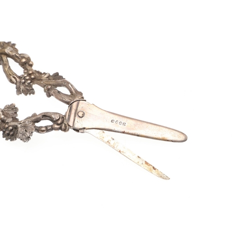 24 - A CASED PAIR OF WILLIAM IV GRAPE SCISSORS. The handles cast as openwork fruiting vines, hallmarked (... 
