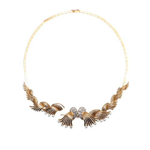 261 - A DIAMOND AND 18CT GOLD NECKLACE. mounted to the front with a scrolling design set with brilliant-cu... 