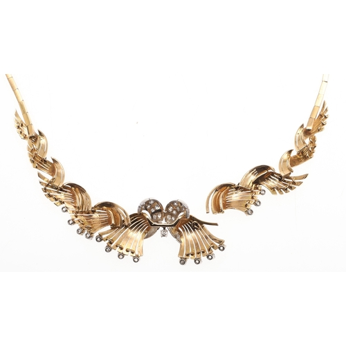 261 - A DIAMOND AND 18CT GOLD NECKLACE. mounted to the front with a scrolling design set with brilliant-cu... 