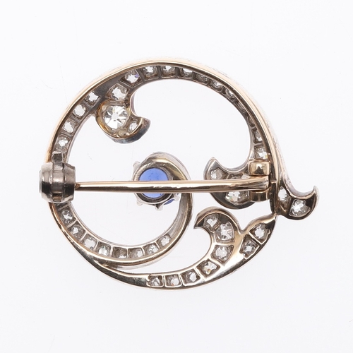 294 - AN EARLY 20TH CENTURY FRENCH SAPPHIRE AND DIAMOND BROOCH. the scrolling openwork mount is centred wi... 