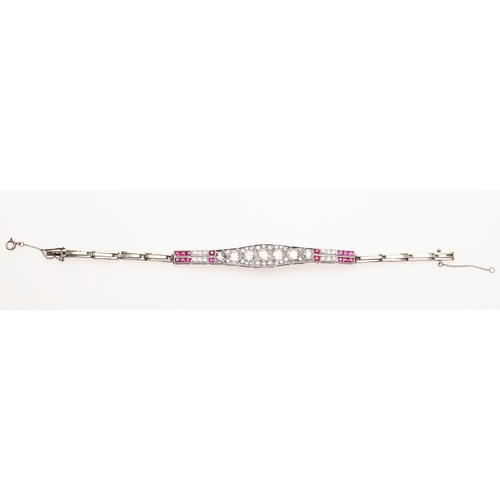 309 - AN ART DECO RUBY AND DIAMOND BRACELET. the bracelet is formed with eleven articulated sections, the ... 