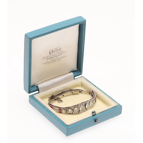 309 - AN ART DECO RUBY AND DIAMOND BRACELET. the bracelet is formed with eleven articulated sections, the ... 