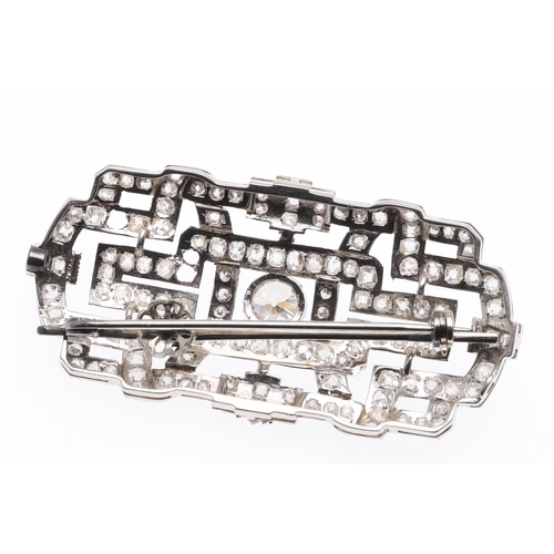 314 - AN ART DECO DIAMOND PLAQUE BROOCH PENDANT. the rectangular-shaped openwork mount collet set with a c... 