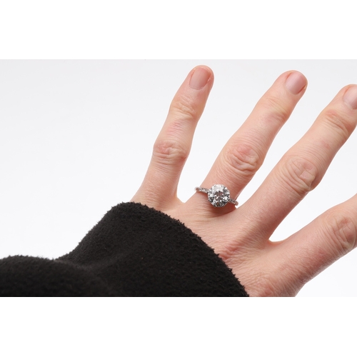 319 - A DIAMOND SOLITAIRE RING. the circular old-cut diamonds weighs approximately 2.70 carats and is set ... 