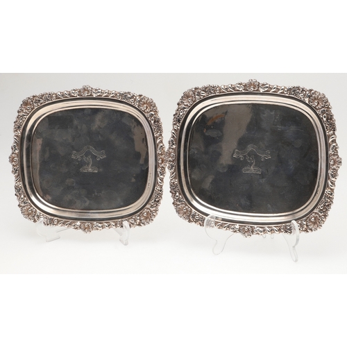 40 - A PAIR OF GEORGE III RECTANGULAR SILVER SALVERS. With cast foliate motif borders and engraved centra... 