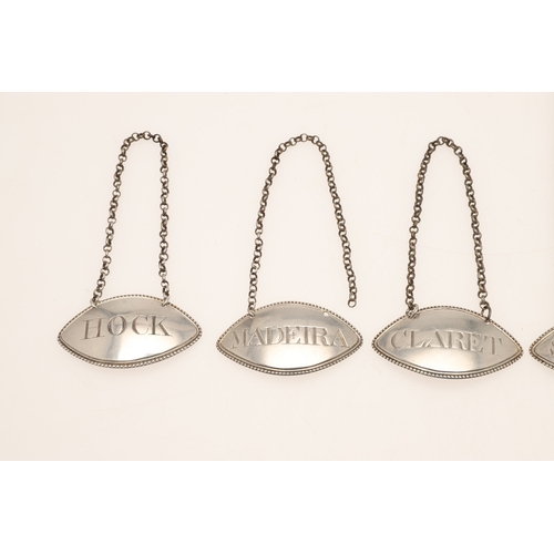 48 - A SET OF FIVE 18TH CENTURY SILVER WINE LABELS. Of oval form, featuring 'Claret', 'Champagne', 'Hock'... 