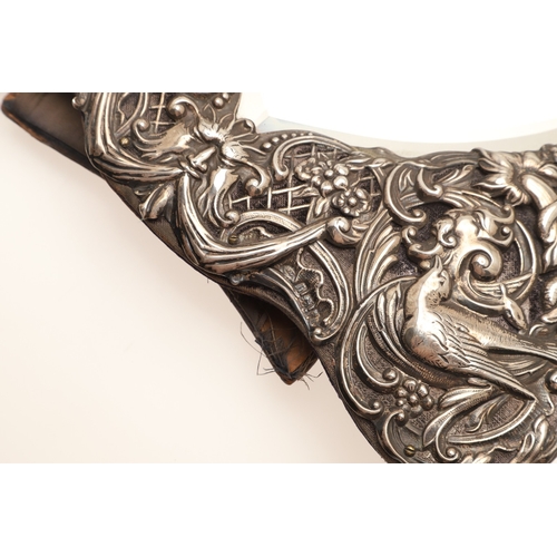 56 - AN EDWARDIAN SILVER ART NOUVEAU STYLE TABLE MIRROR. Of shaped form, the bevelled edge heart shape mi... 