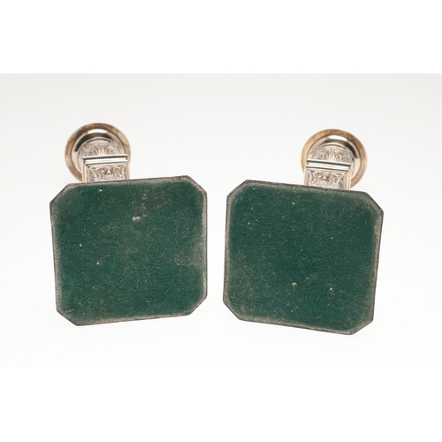 61 - A PAIR OF EARLY 20TH CENTURY FILLED SILVER CANDLESTICKS. In the Adam style, each candlestick being d... 