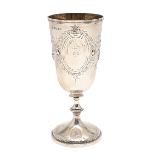 62 - A VICTORIAN SILVER GOBLET. With engraved and repousse decoration of floral cartouches and other desi... 