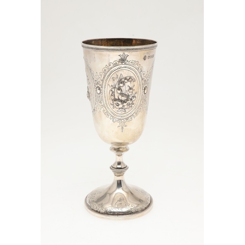 62 - A VICTORIAN SILVER GOBLET. With engraved and repousse decoration of floral cartouches and other desi... 