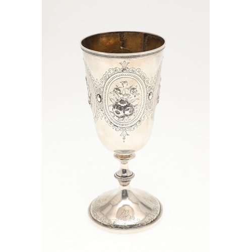 62 - A VICTORIAN SILVER GOBLET. With engraved and repousse decoration of floral cartouches and other desi... 