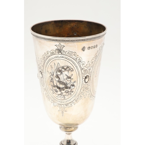 62 - A VICTORIAN SILVER GOBLET. With engraved and repousse decoration of floral cartouches and other desi... 