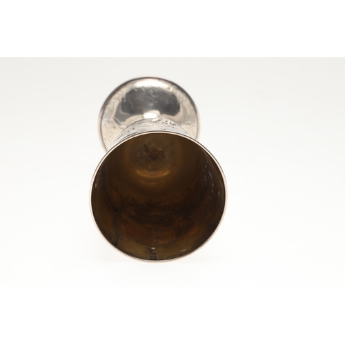 62 - A VICTORIAN SILVER GOBLET. With engraved and repousse decoration of floral cartouches and other desi... 
