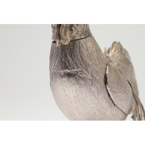 69 - A PAIR OF EARLY 20TH CENTURY IMPORTED SILVER STUDIES OF COCKERELS. Of the same pose, with foreign ma... 