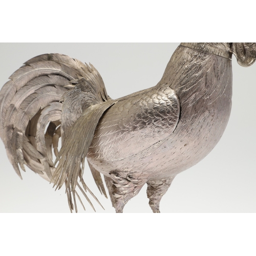 69 - A PAIR OF EARLY 20TH CENTURY IMPORTED SILVER STUDIES OF COCKERELS. Of the same pose, with foreign ma... 