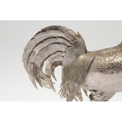 69 - A PAIR OF EARLY 20TH CENTURY IMPORTED SILVER STUDIES OF COCKERELS. Of the same pose, with foreign ma... 