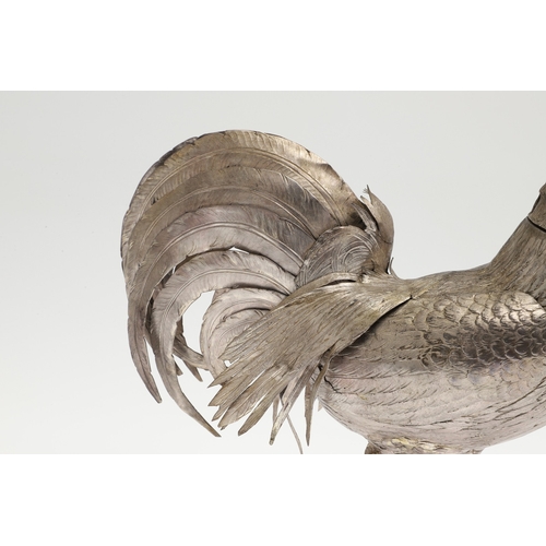 69 - A PAIR OF EARLY 20TH CENTURY IMPORTED SILVER STUDIES OF COCKERELS. Of the same pose, with foreign ma... 
