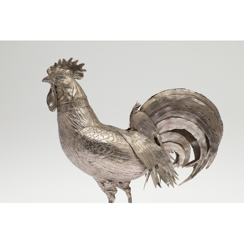 69 - A PAIR OF EARLY 20TH CENTURY IMPORTED SILVER STUDIES OF COCKERELS. Of the same pose, with foreign ma... 