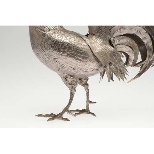 69 - A PAIR OF EARLY 20TH CENTURY IMPORTED SILVER STUDIES OF COCKERELS. Of the same pose, with foreign ma... 
