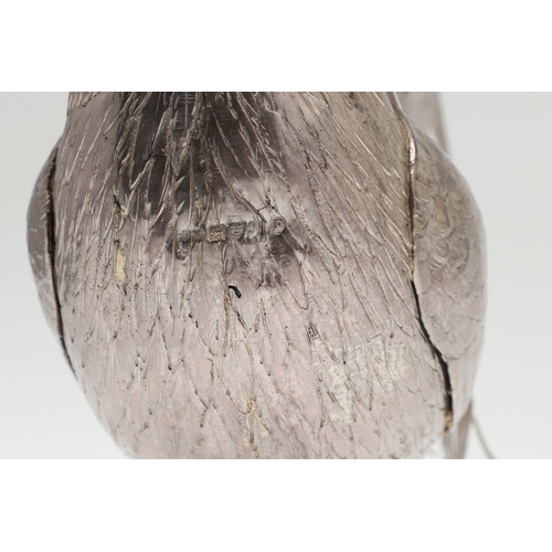 69 - A PAIR OF EARLY 20TH CENTURY IMPORTED SILVER STUDIES OF COCKERELS. Of the same pose, with foreign ma... 