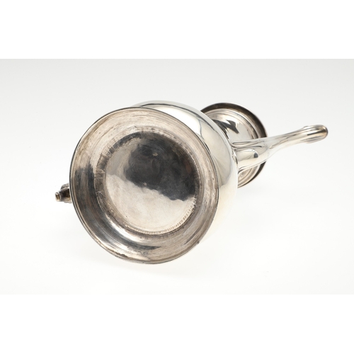 74 - A LATE GEORGE II SILVER COFFEE POT. Of plain baluster form, with scroll handle and round foot, the l... 